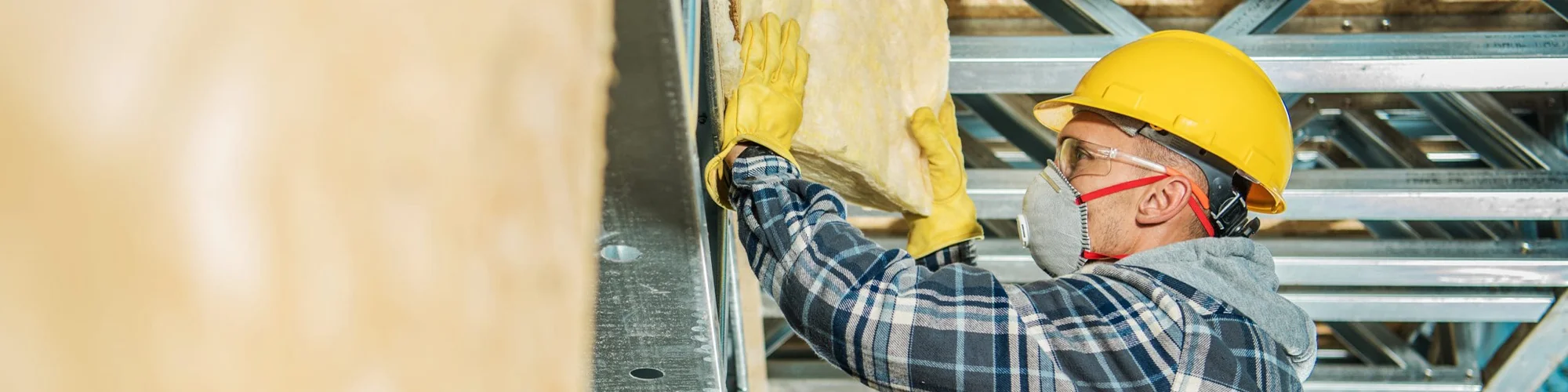 worker removing insulation